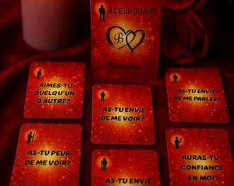 May include: A set of red and gold cards with questions about love and relationships. The cards feature a silhouette of a person and the text "A coeur ouvert" which translates to "open heart".