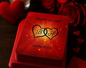 May include: A stack of red cards with a gold heart design and the text "Les Mots du Coeur" and "Caroline Rossi". The cards are surrounded by red roses and hearts.