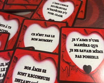 May include: A collection of red and white cards with black text. Each card features a white heart shape with phrases like "I love you in a way I didn't know was possible." The cards have a red border and a heartbeat design.