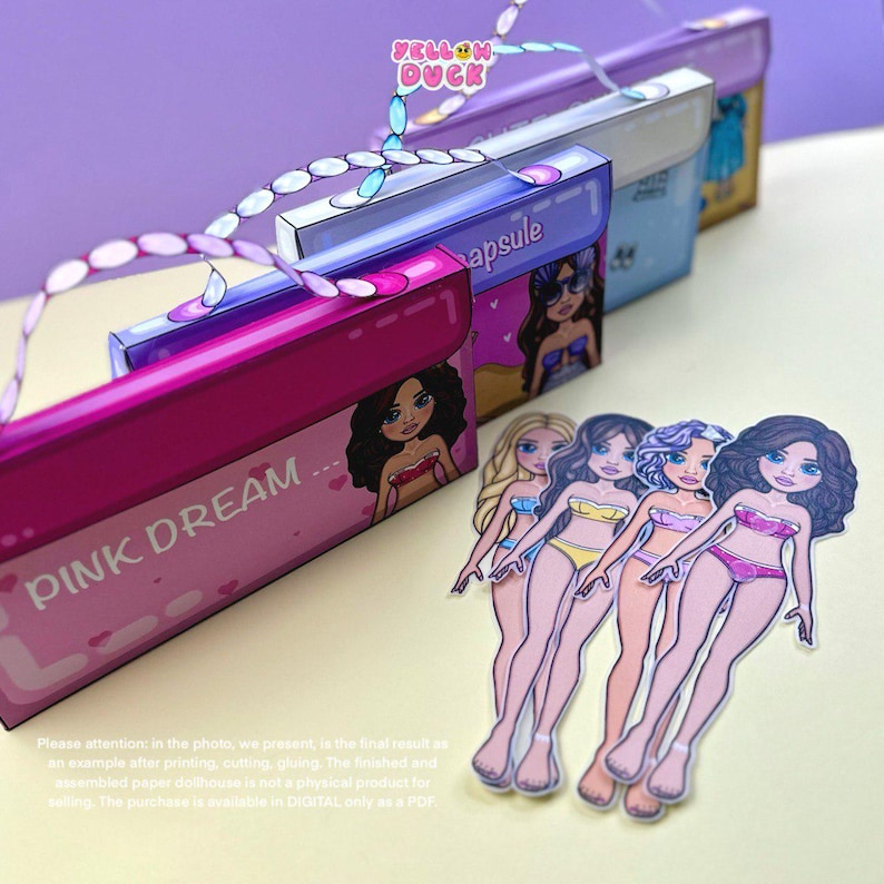 May include: A display of paper dollhouses in pink, blue, and purple, with illustrations of women in swimwear. The dollhouses have the words "PINK DREAM" and "apsule" printed on them. The image also includes paper dolls.