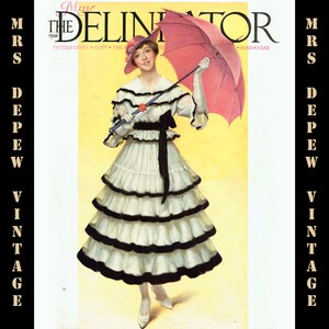 May include: Vintage magazine cover art featuring a woman in a white tiered dress with black trim, holding a pink parasol. The cover is titled "The Delineator" with the date "May 1916". The background is yellow.