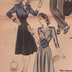 May include: Vintage fashion illustration featuring two women in dresses. One dress is navy blue with a fitted bodice and flared skirt. The other dress is light gray with a dark blue diamond-shaped detail at the waist. The illustration includes text.