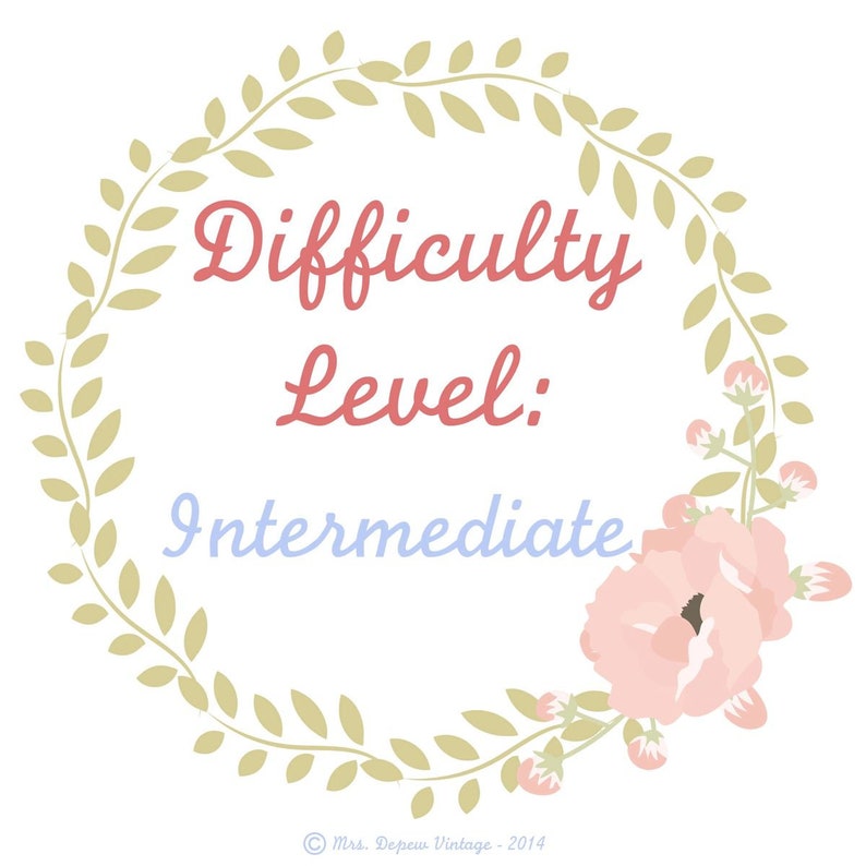 May include: A floral wreath design with the words "Difficulty Level: Intermediate" in a vintage style. The text is in red and blue, surrounded by a wreath of green leaves and pink flowers. The image has a soft, pastel color palette.
