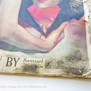 May include: A vintage magazine cover featuring a black and white illustration of a woman wearing a red and black dress. The text on the cover reads "Novel By Samuel Memein".