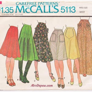 May include: A vintage McCall's 5113 sewing pattern envelope for a misses' set of skirts. The illustration displays six skirt variations in red, green, floral print, pinstripe, yellow, and orange floral print, featuring various lengths and pocket styles.