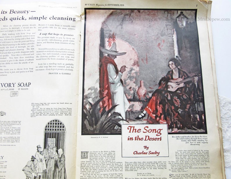 May include: A vintage magazine page featuring an illustration of a woman playing a guitar in a desert setting. The text reads "The Song in the Desert" by Charles Saxby. The magazine is from September 1923.