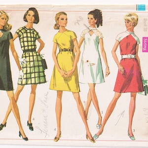 May include: A vintage sewing pattern for four different dress styles. The pattern is from Simplicity and is number 8139. The dresses are all short and have different necklines and sleeve lengths. The pattern is for sizes 12-16.