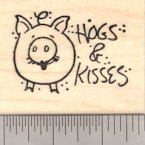 May include: A black and white rubber stamp with a cartoon pig and the text "Hogs & Kisses".