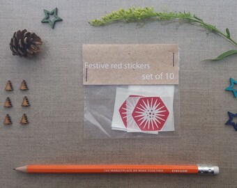 Festive red and white snowflake/star stickers - ideal finishing touch for envelopes and gifts