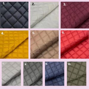 May include: A collection of quilted fabric samples in various colors. The samples include navy blue, off-white, burgundy, mustard yellow, taupe, red, silver, charcoal gray, dark blue, and olive green. Each sample has a diamond pattern.