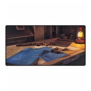 May include: A wooden table with a blue blueprint, a pencil, a gun, and a kerosene lamp. The table is covered in a brown cloth and has a drawer.