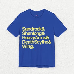 May include: A royal blue t-shirt with a yellow graphic print that reads "Sandrock & Shenlong & HeavyArms & DeathScythe & Wing."