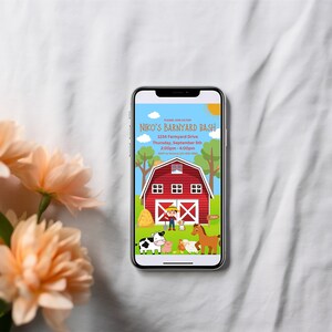 May include: A smartphone displaying a red barn with a white X on the door. The text on the screen reads "Niko's Barnyard Bash", "1234 Farmyard Drive", "Thursday, September 28th", "2:00pm - 4:00pm".