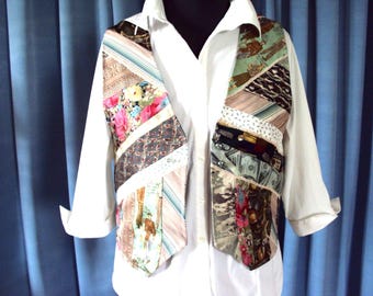 May include: A patchwork vest made from repurposed neckties. The vest features a variety of patterns, including floral, striped, and geometric designs. It is worn over a white button-down shirt. The vest is a unique and colorful fashion statement.