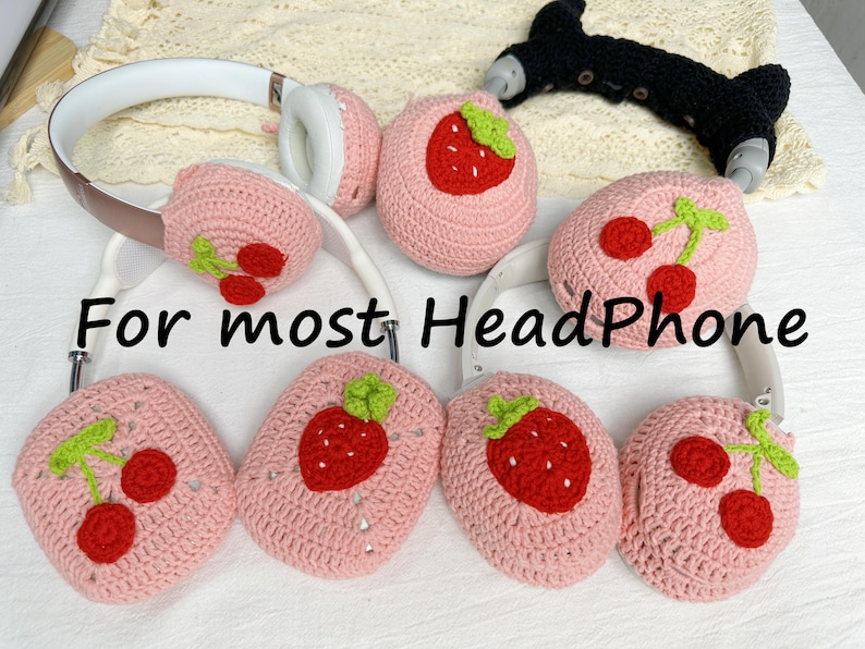 May include: Pink crocheted headphone covers with strawberry and cherry designs.  For most HeadPhone.