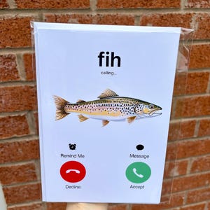 May include: A white card featuring a fish illustration and the word "fih". The card design mimics a phone interface, with options like "Remind Me", "Decline", "Message", and "Accept".
