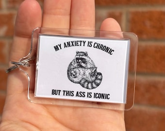 My anxiety is chronic but this ass is iconic, funny raccoon meme keyring, funny anxiety gift, funny mental health gift