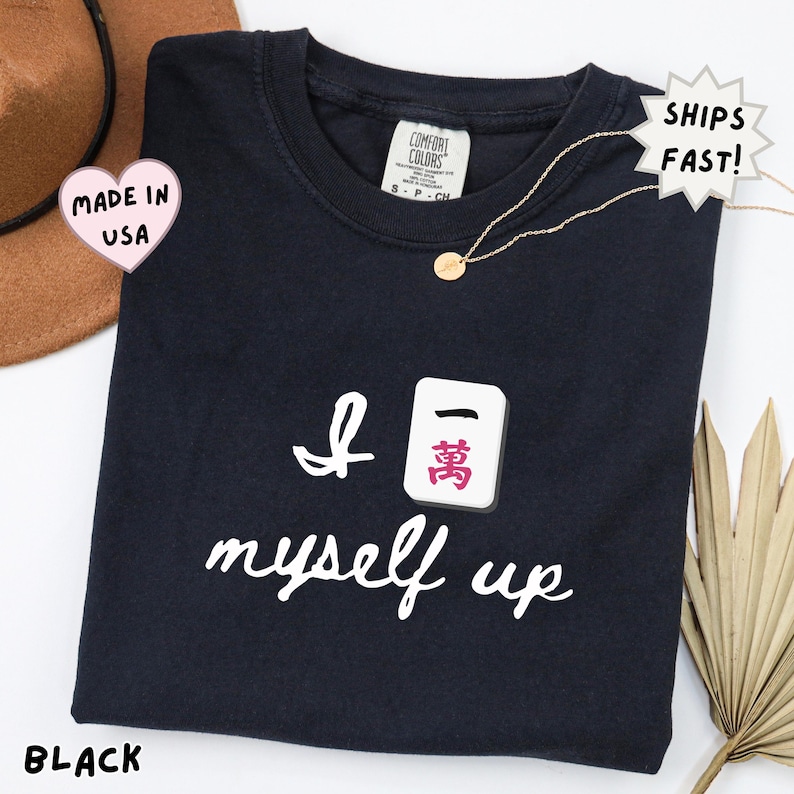comfort colors black mahjong shirt with bold pink “I crack myself up” design and Crak tile, high contrast statement tee for mahjong lovers, perfect for game nights and social events