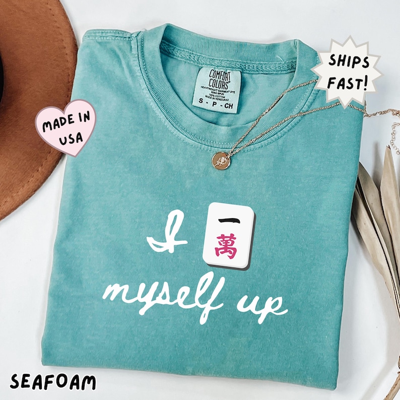 comfort colors seafoam mahjong shirt with “I crack myself up” Crak tile design, fresh and bright option for mahjong players, perfect for spring outfits and casual game nights