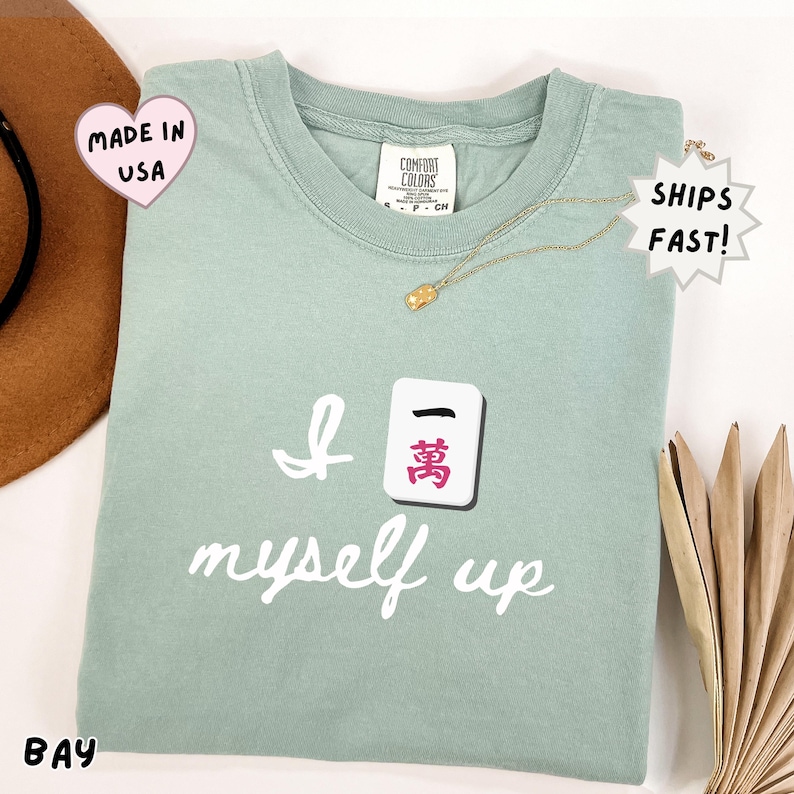 comfort colors bay green mahjong shirt featuring Crak tile and “I crack myself up” pun, cozy lifestyle tee for mahjong lovers, perfect for relaxing, social game nights, and hobby outfits
