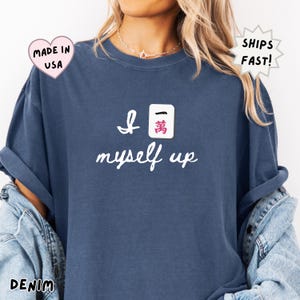 comfort colors denim blue mahjong shirt worn casually, featuring Crak tile and “I crack myself up” phrase, stylish everyday outfit for women who love mahjong and relaxed fashion