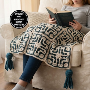 May include: A crochet blanket featuring a repeating geometric motif in dark teal and cream yarn. The blanket has large dark teal tassels at the corners. A circular black badge on the image contains the text: ENGLISH PDF CROCHET MOTIF PATTERN.
