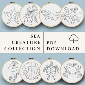 May include: A set of eight black and white line drawings of sea creatures, including a starfish, jellyfish, whale, octopus, seahorse, seashell, turtle, and crab. The drawings are in embroidery hoops, suggesting a craft project.