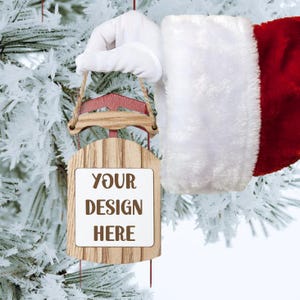 New Ornament Sled Mockup Digital File, Santa Holding Christmas Sled Ornament PNG, Snowy Holiday Christmas Tree Ornament Instant Download