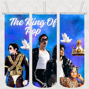 May include: A blue and purple ombre tumbler with a white design that says "The King Of Pop" and features images of Michael Jackson.