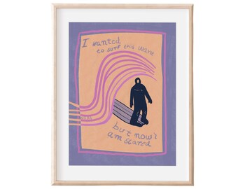 May include: Framed art print with a surfer illustration. The artwork has a purple border and a peach background with the text "I wanted to surf this wave but now I am scared." A dark blue figure stands on a surfboard with purple wave lines.