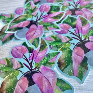 May include: A set of six pink and green watercolor stickers featuring a potted plant with the text "a quartzy life".