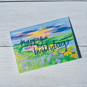 Tarjeta de cumpleaños del paisaje del atardecer