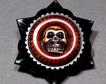 Botón de calavera pirata