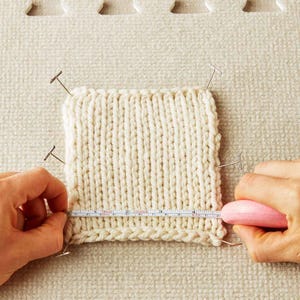Knitting project in progress with Cocoknits tape measure being used for precision measurements.