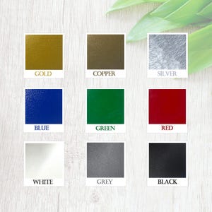 May include: Nine color swatches in a grid format. The colors are gold, copper, silver, blue, green, red, white, grey, and black.