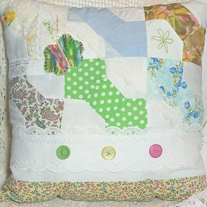 Butterfly appliqued on multi-color cutter quilt-top pillow bow-tie pattern
