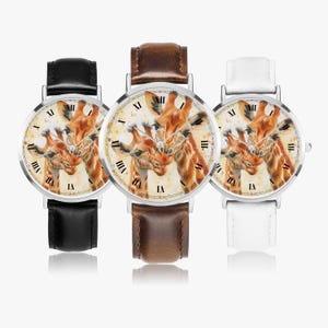 May include: Three wristwatches with silver cases and different coloured leather straps. Each watch face features a colourful illustration of two giraffes.
