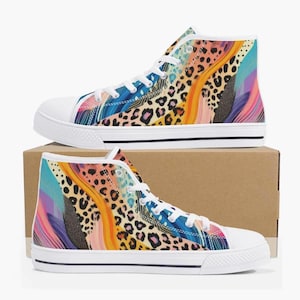 May include: White high-top canvas shoes with a colorful abstract print featuring leopard spots, swirls, and streaks of blue, orange, pink, and purple.