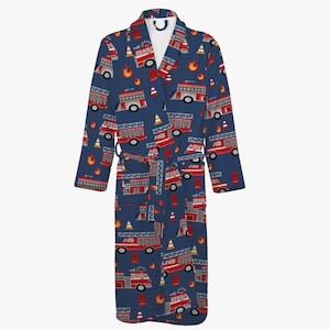 May include: A blue dressing gown featuring a repeating design of red fire engines, flames, and traffic cones. The gown has long sleeves, a belt, and a shawl collar. The material looks soft and comfortable.