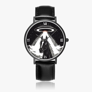 May include: Black wristwatch with a black leather band. The watch face features a black and white illustration of a horse beneath a UFO, with Roman numerals marking the hours. The watch has a black bezel and a black crown.