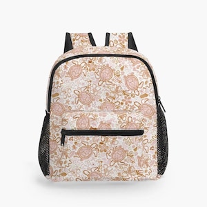 May include: A white backpack featuring a repeating pattern of pink sea turtles and brown flowers. The backpack has black mesh side pockets and black straps. A black zip pocket is on the front.
