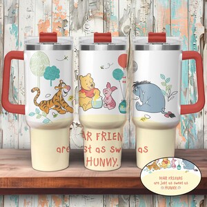 May include: Three white travel mugs with red handles and lids, featuring Winnie the Pooh characters. Each mug has a different character: Tigger, Winnie the Pooh, Piglet, and Eeyore. The text "DEAR FRIENDS are just as sweet as HUNNY" is also displayed.