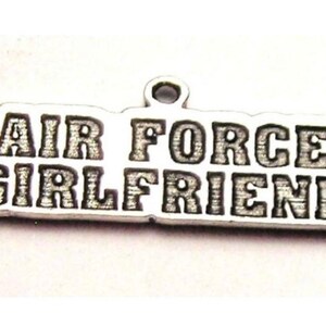 May include: Silver charm with the words "Air Force Girlfriend" engraved on it.