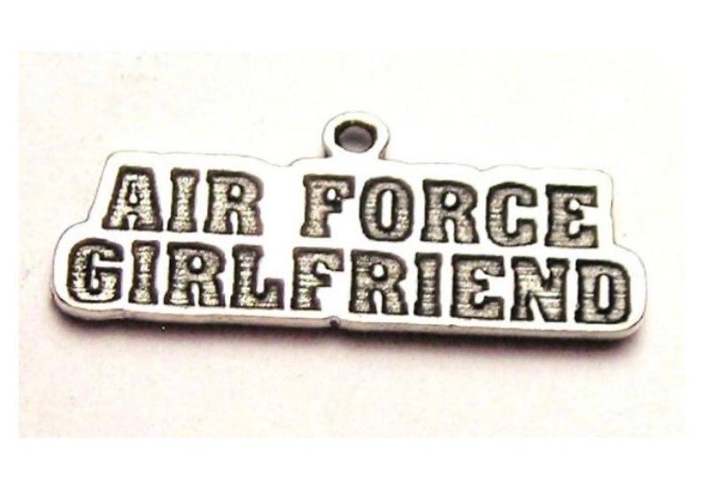 May include: Silver charm with the words "Air Force Girlfriend" engraved on it.