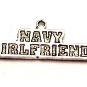 May include: Silver charm with the words "NAVY GIRLFRIEND" engraved on it.