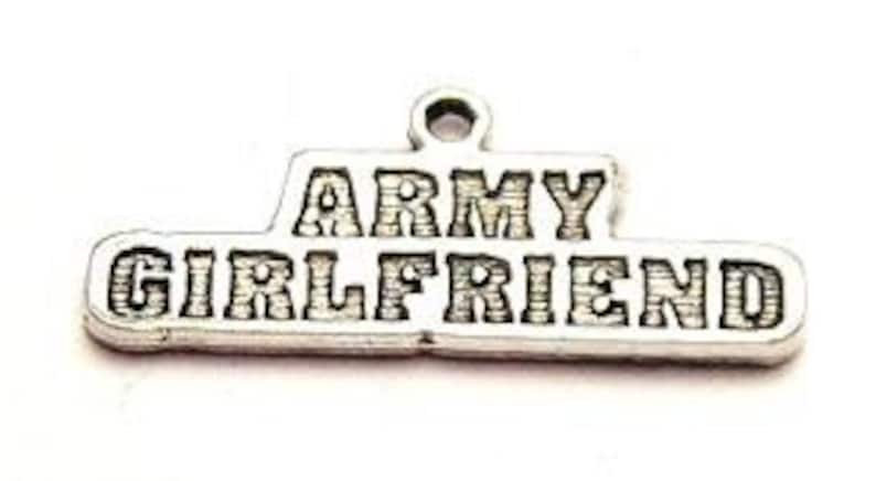 May include: Silver charm with the words "Army Girlfriend" engraved on it.