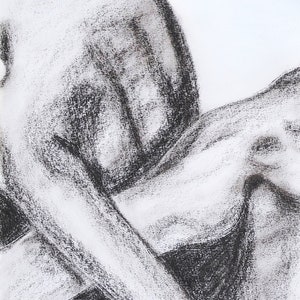 May include: A black and white charcoal drawing of abstract shapes, resembling a body.