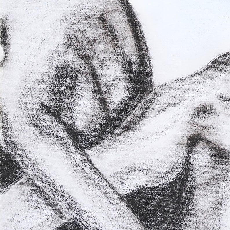 May include: A black and white charcoal drawing of abstract shapes, resembling a body.