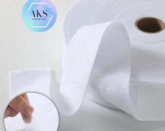 May include: A roll of white fabric, possibly for crafting or cleaning, with a visible core. The image includes a circular inset showing the fabric's texture and a logo that reads "AKS AnyKinds Store" in a hexagon.