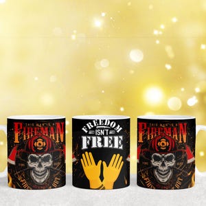 May include: Three ceramic coffee mugs with different designs. The first mug has a skull with a fireman's helmet and the text "This Man's a Fireman, First, Second, and Always". The second mug has the text "Freedom Isn't Free" with two yellow hands in the shape of a heart. The third mug has the same skull design as the first mug.